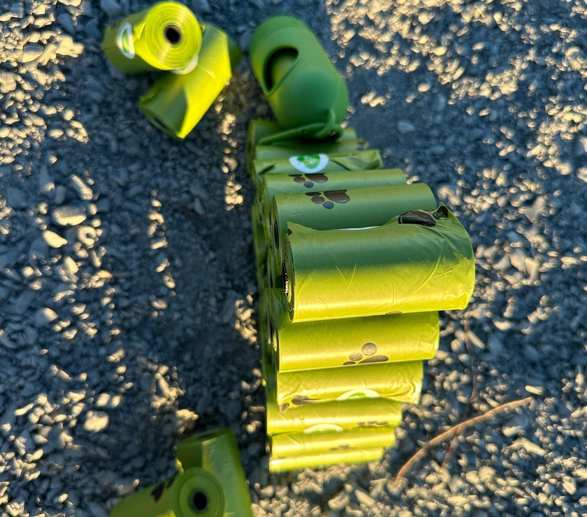 biodegradable trash pet poop bags along with a dispenser designed for convenience and environmental sustainability