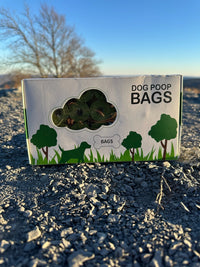 biodegradable trash pet poop bags along with a dispenser designed for convenience and environmental sustainability