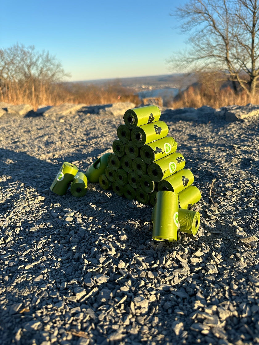 biodegradable trash pet poop bags along with a dispenser designed for convenience and easy to tear